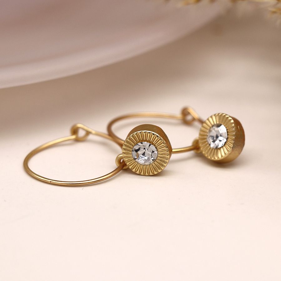 Golden wire hoop and embossed crystal drop earrings