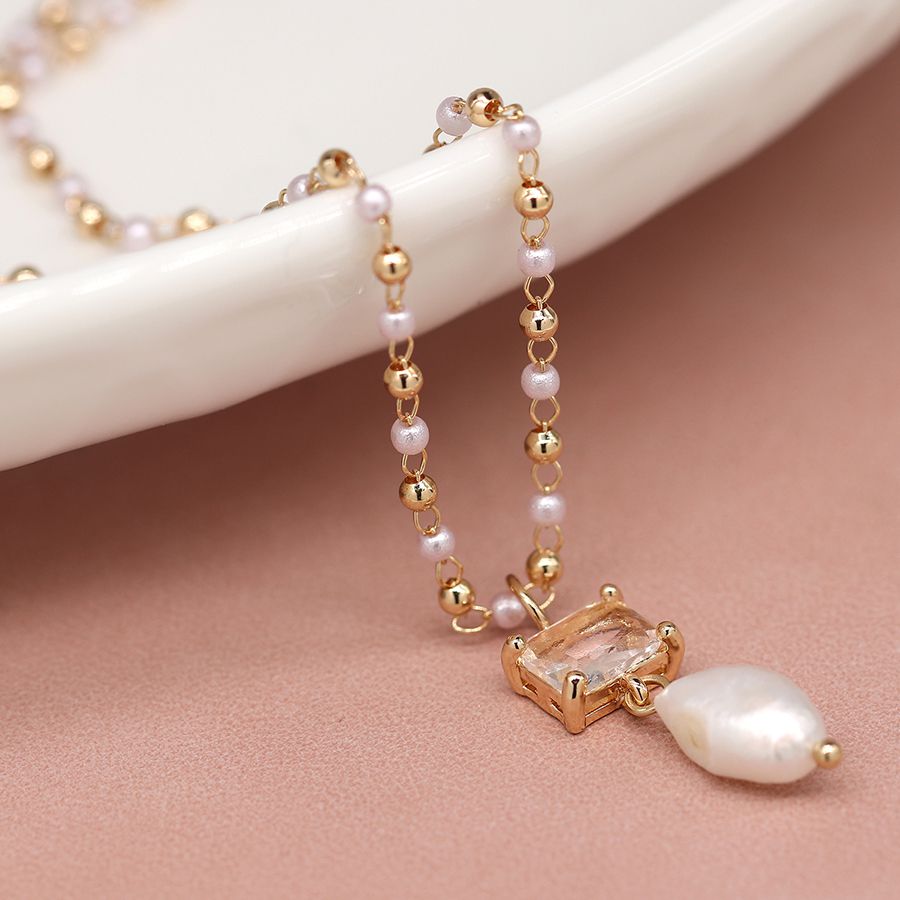 Golden bead and pearl necklace with crystal and pearl drop