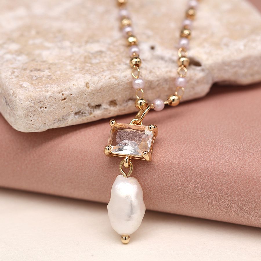 Golden bead and pearl necklace with crystal and pearl drop