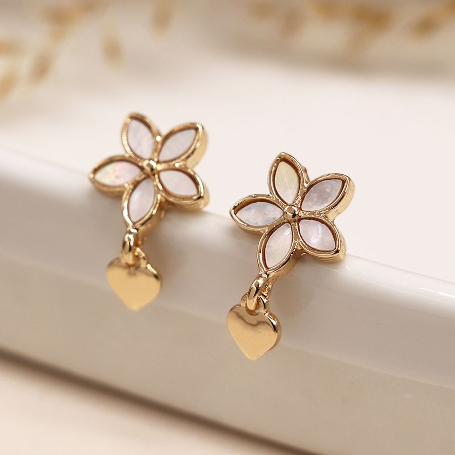 Golden shell inset flower and heart charm earrings