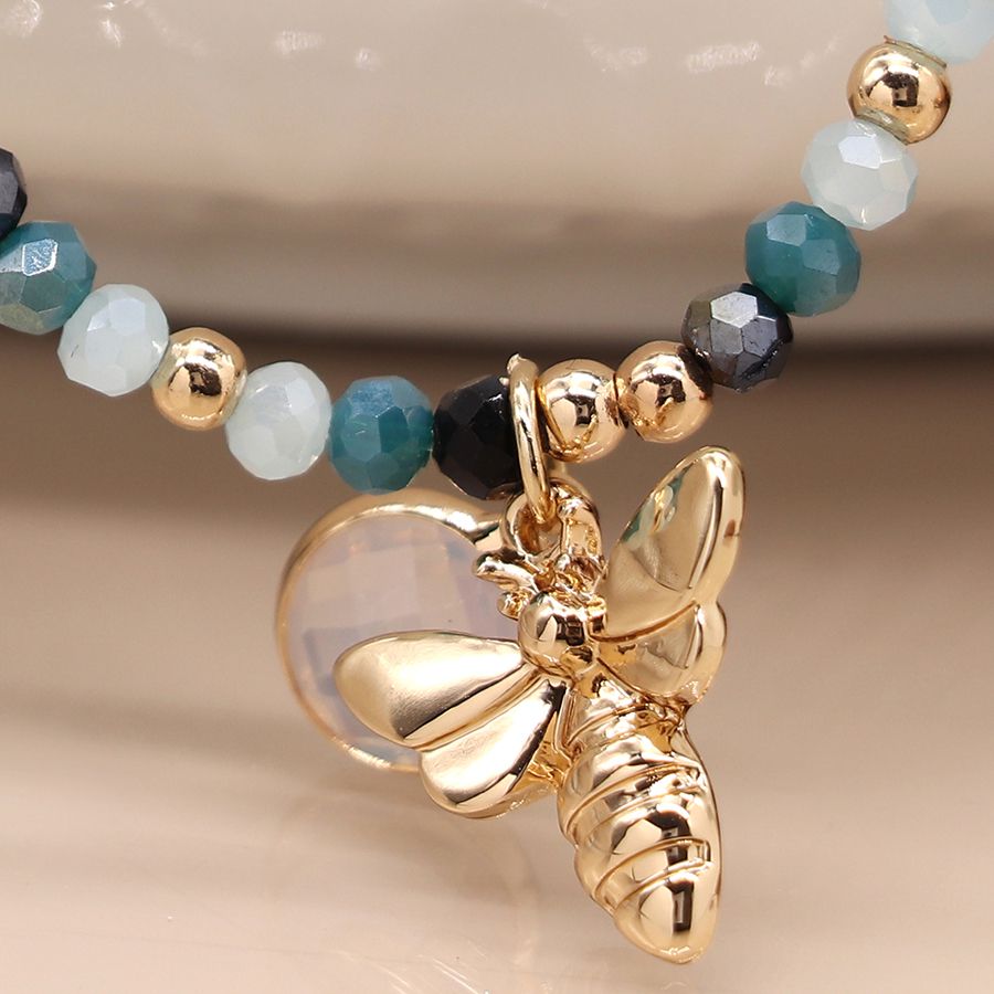 Blue bead bracelet with gold bee and crystal