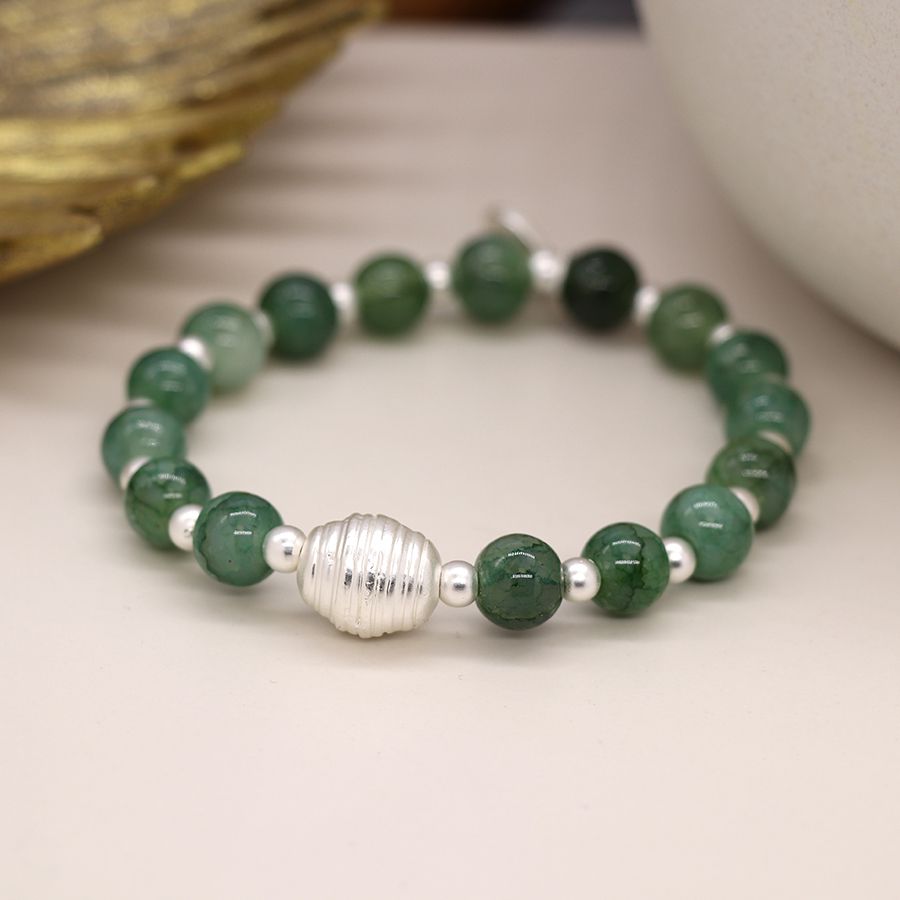 Green and silver plated bead bracelet with silver groove bead