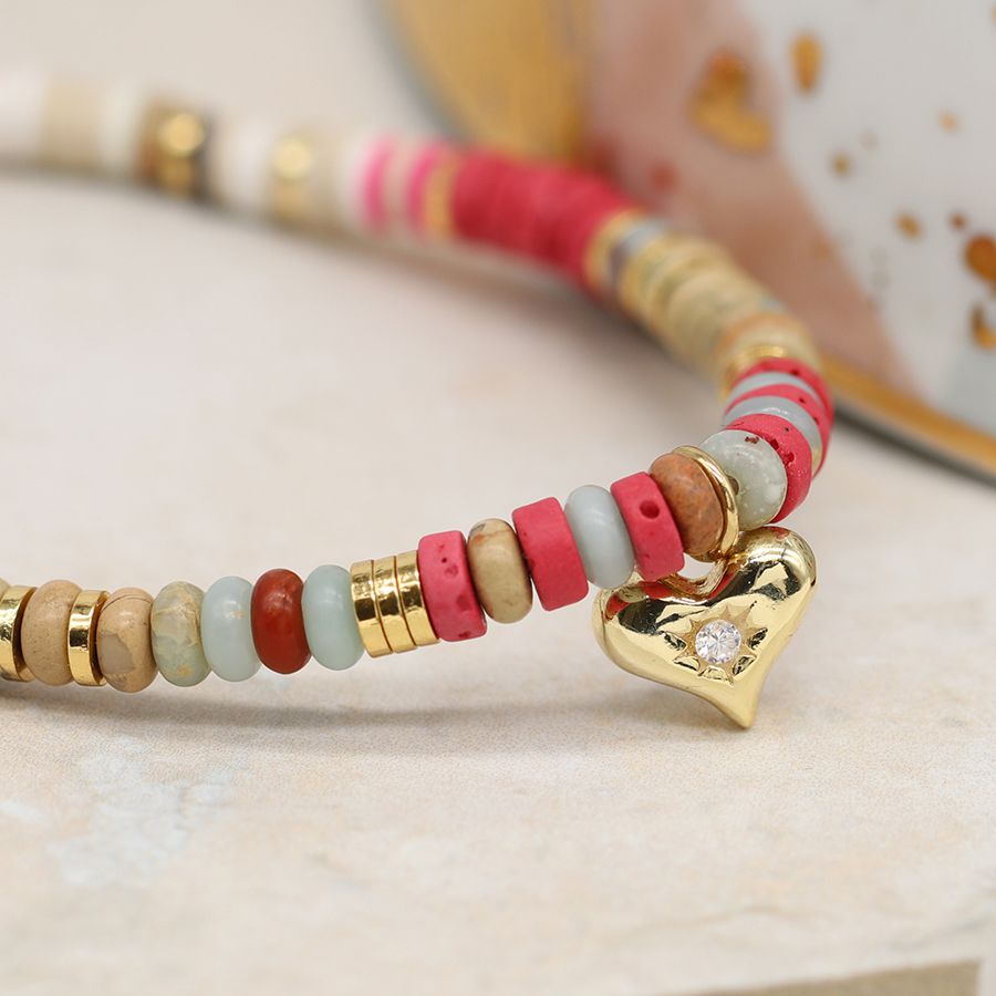 Pink mix bead bracelet with a golden crystal inset heart charm