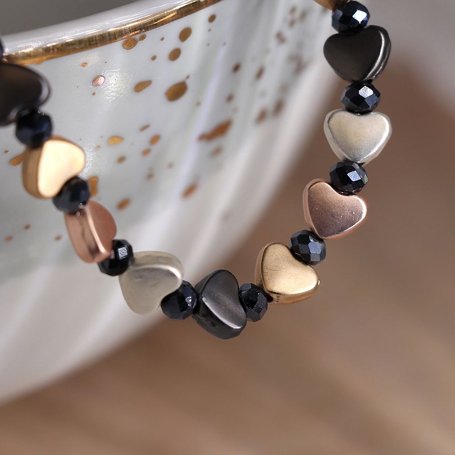 Mixed metallic heart bracelet with black beads