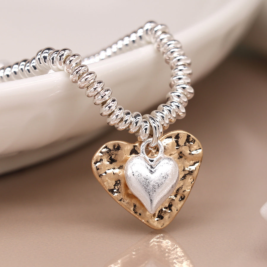 Silver plated bead bracelet with beaten gold and worn silver hearts