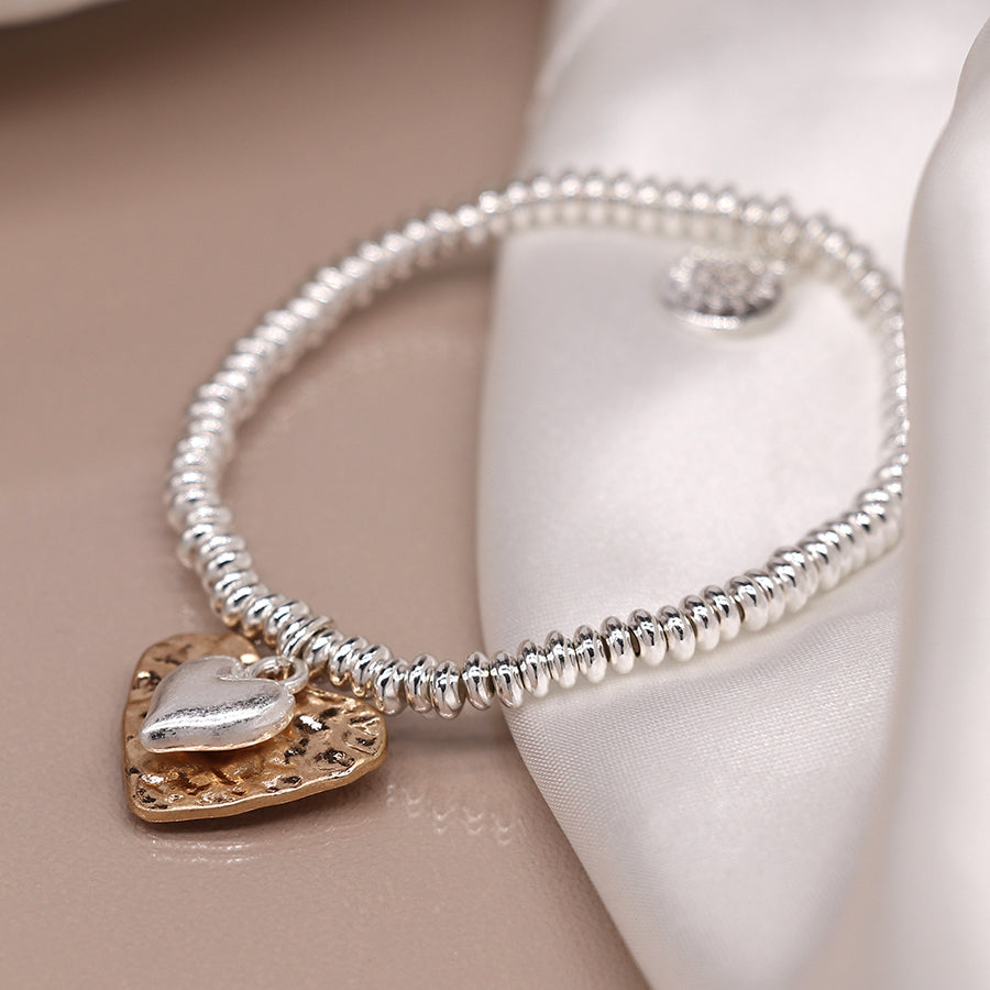 Silver plated bead bracelet with beaten gold and worn silver hearts
