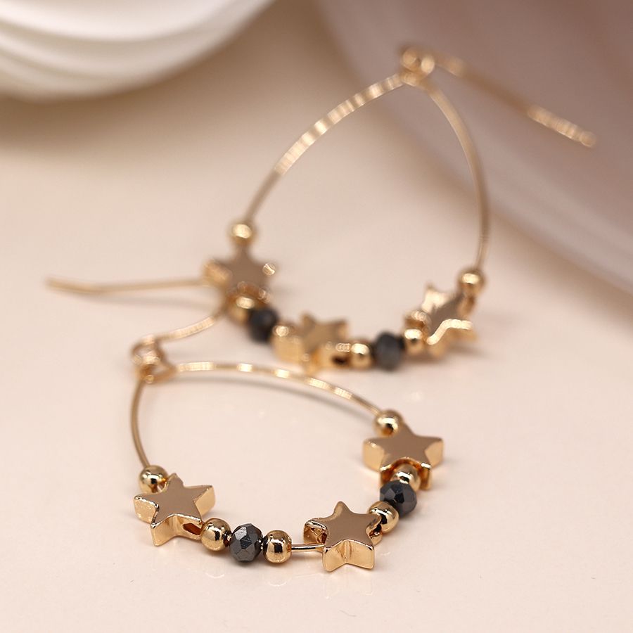 Faux gold plated stars and black bead teardrop earrings