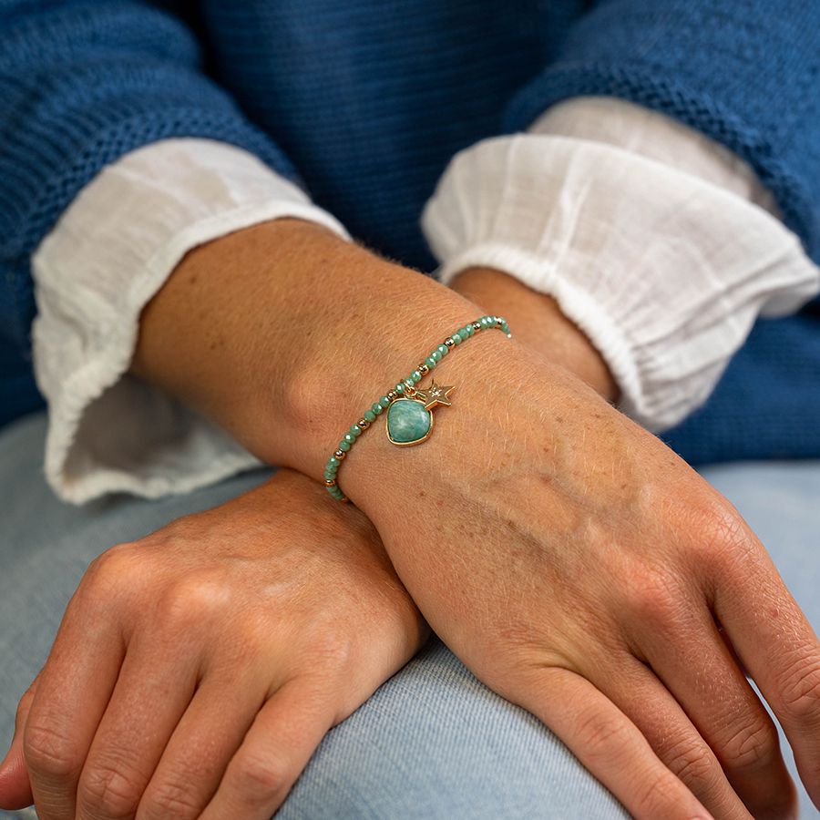 Sea green and golden charm bracelet with star and stone