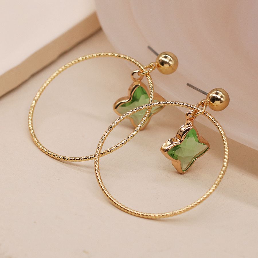 Golden textured hoop and green star stone earrings