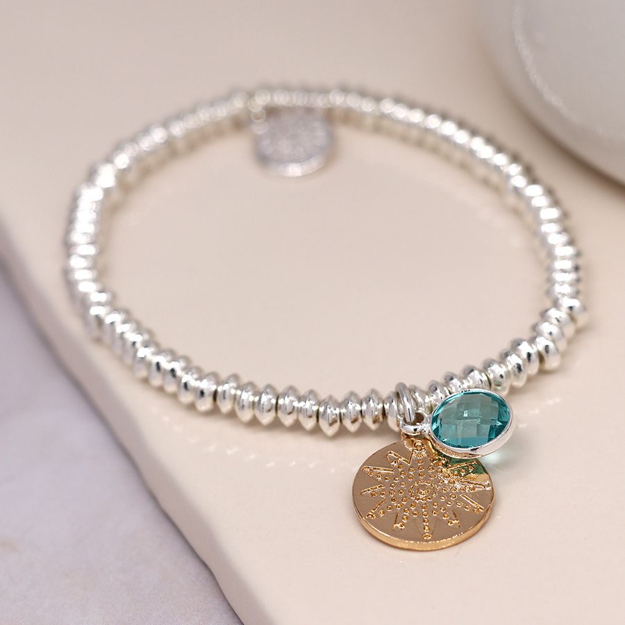 Silver plated bead bracelet with golden disc and aqua crystal