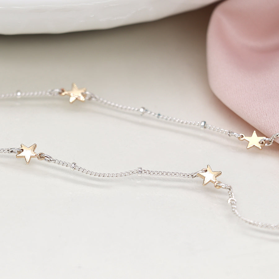 Silver plated station chain and faux gold stars necklace