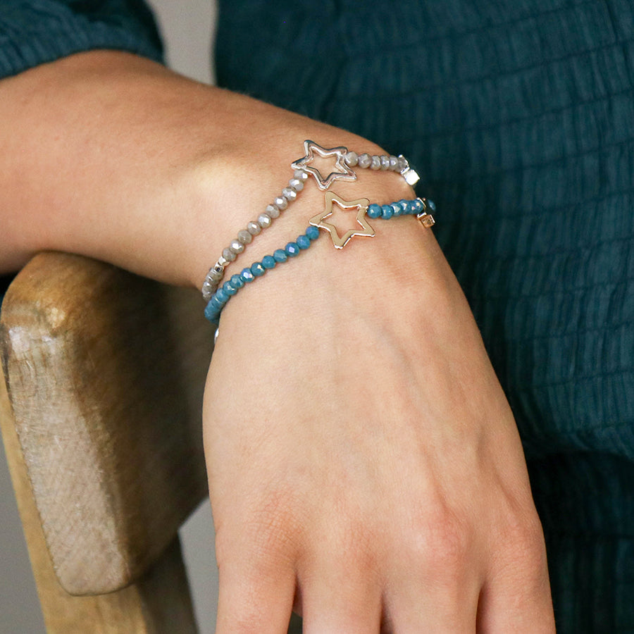 Grey bead bracelet with silver plated solid and open stars