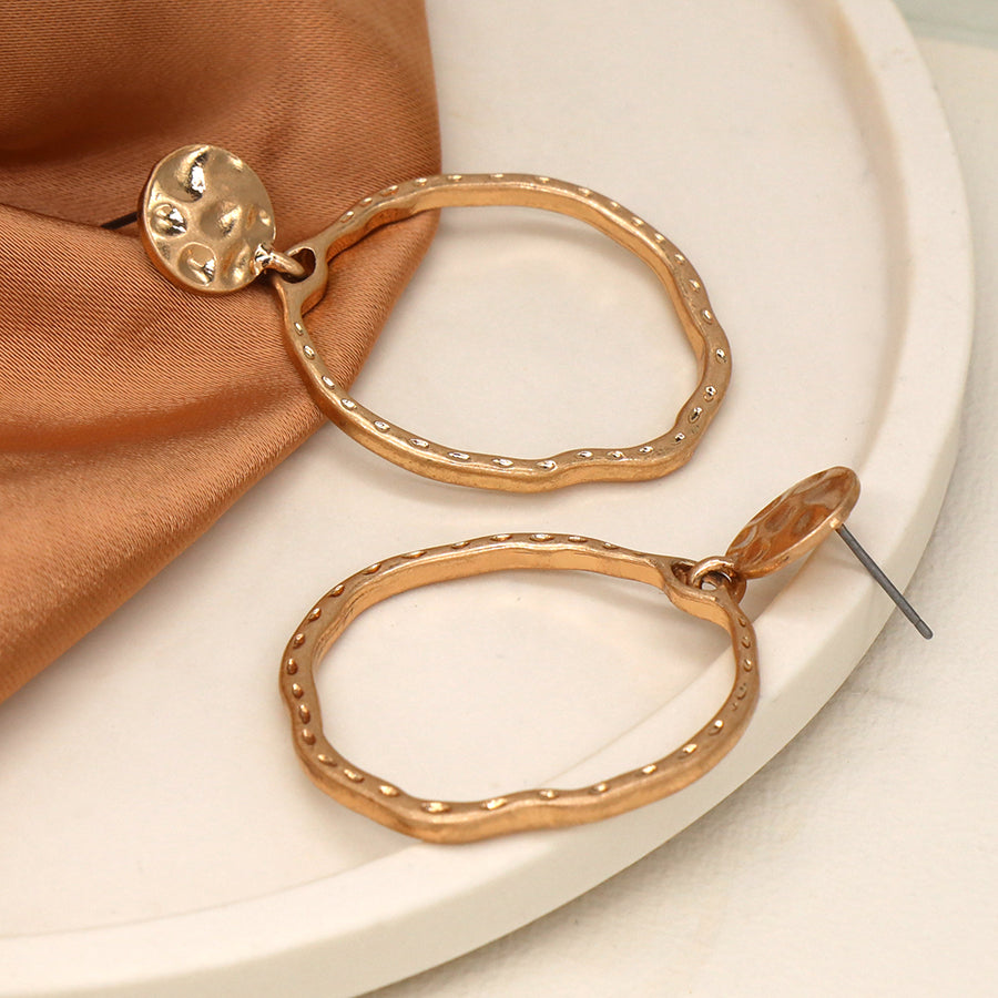 Golden hammered disc and hoop earrings