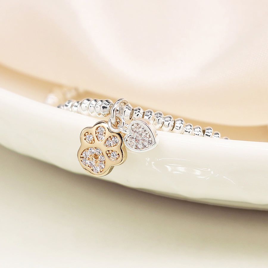 Silver plated crystal heart and golden paw charm bracelet
