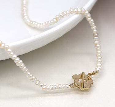 Ivory freshwater pearl and golden retro flower clasp necklace