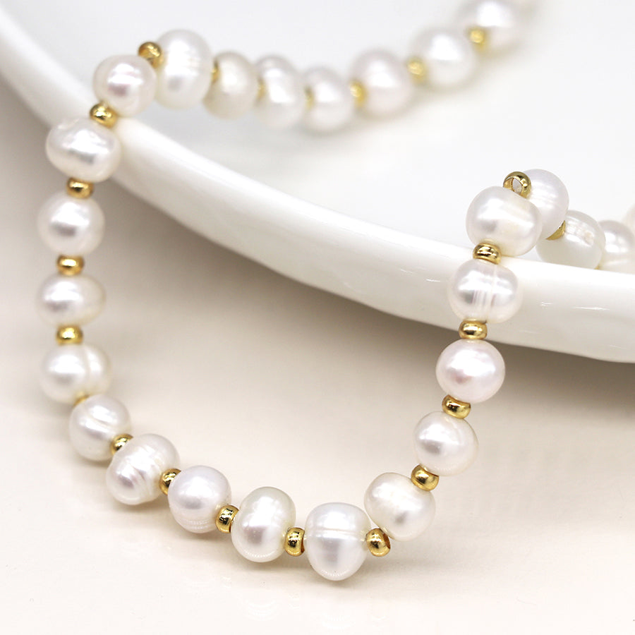Ivory freshwater pearl and golden bead necklace