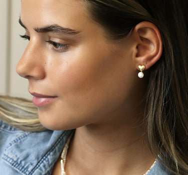 Golden brushed heart and pearl stud earrings