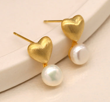 Golden brushed heart and pearl stud earrings