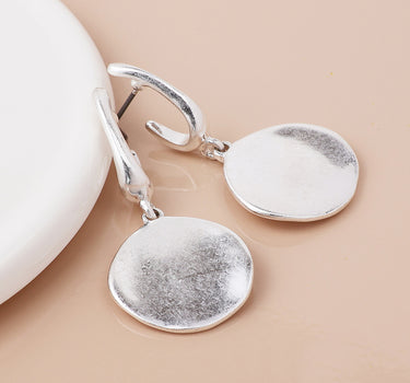 Silver plated worn disc drop earrings
