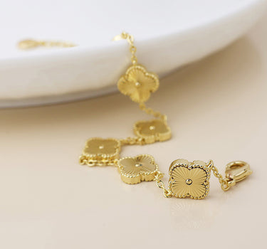 Faux gold plated quatrefoil station bracelet