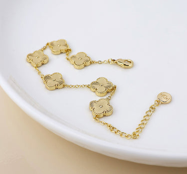Faux gold plated quatrefoil station bracelet