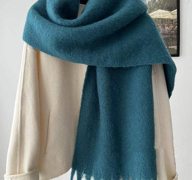 Solid scarf with large fringe