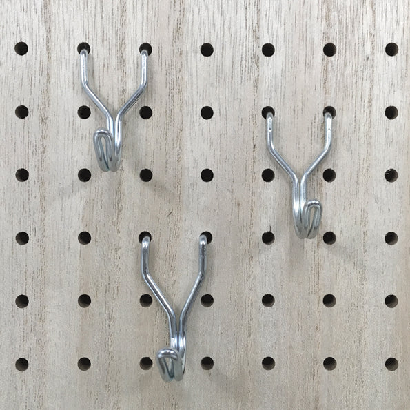 Metal hook for pegboard