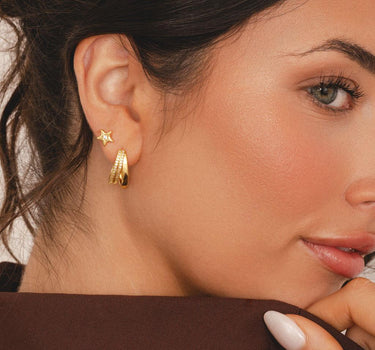Gold sparkling dainty star studs