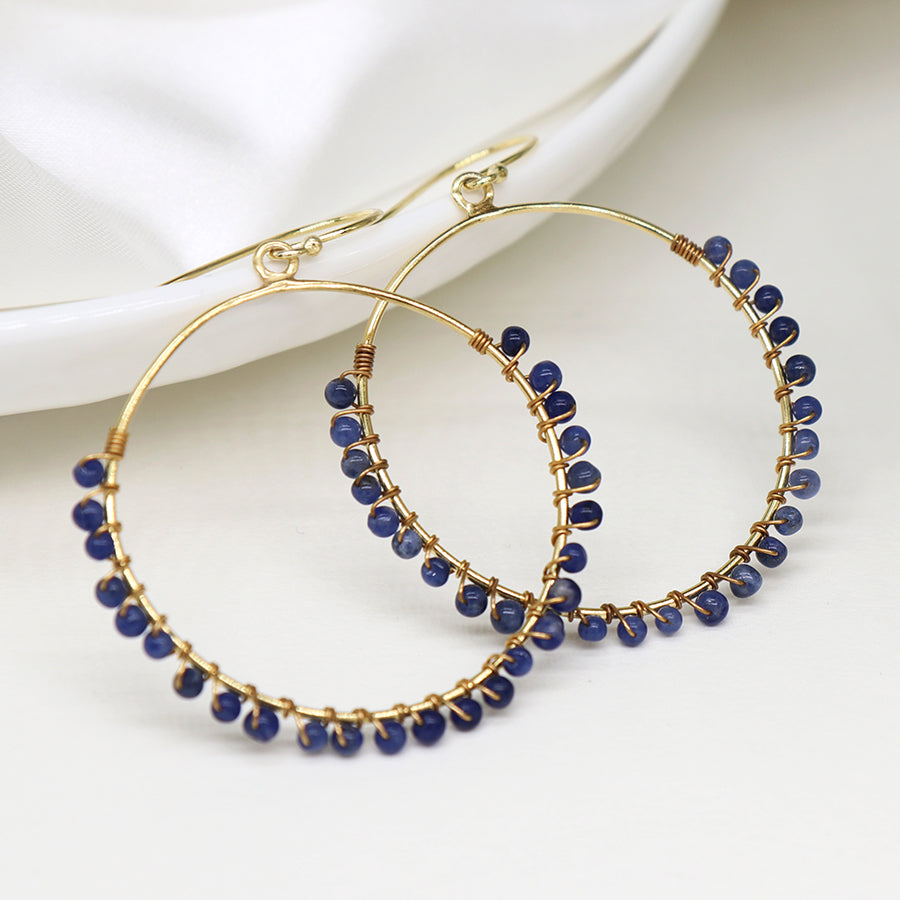 Gold plated hoop earrings with sodalite beads