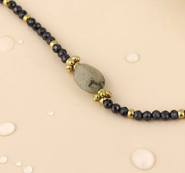 Nyx stainless steel gold plated grey bead bracelet