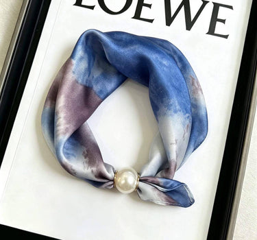 Satin scarf with magnetic pearl attachment