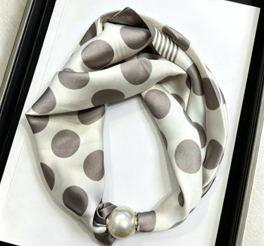 Satin scarf with magnetic pearl fastener