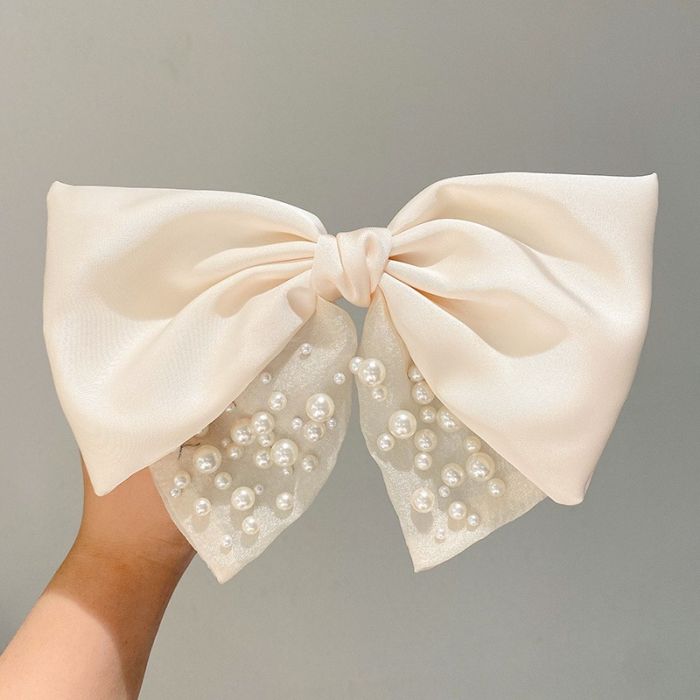 Satin hair bow with pearl details in Ivory