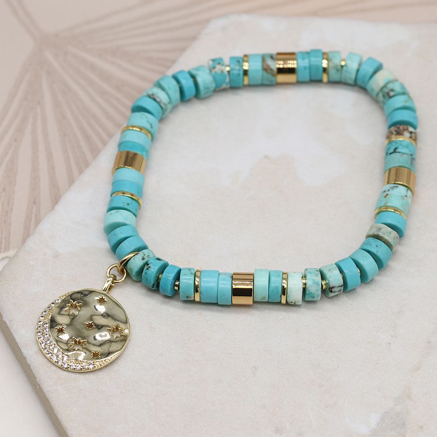 Turquoise and gold mix bracelet with golden crystal star disc