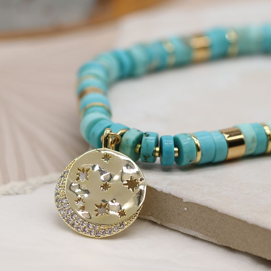 Turquoise and gold mix bracelet with golden crystal star disc