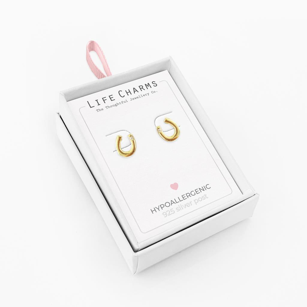 Lucky horseshoe gold stud earrings